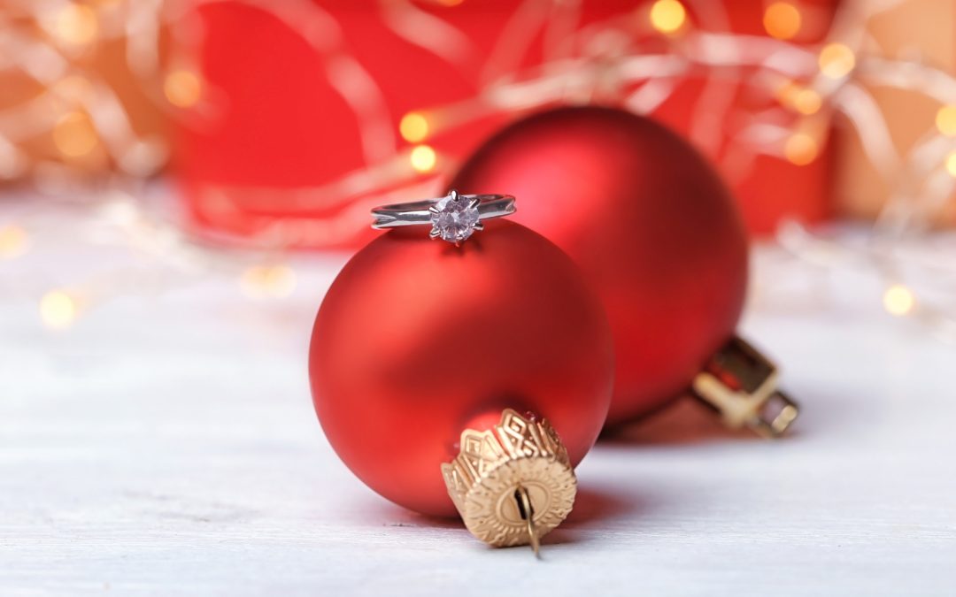Engagement ring and Christmas balls on table for jewellery appraisals